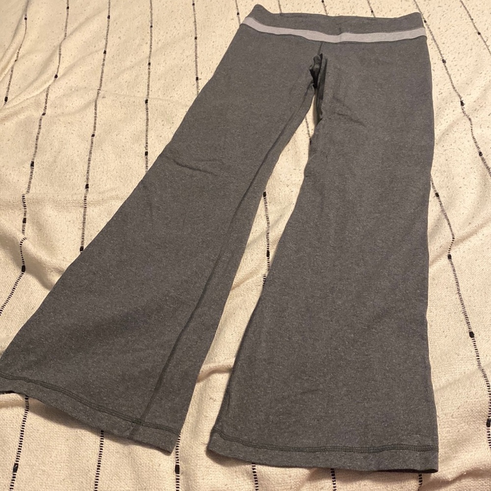 EUC Lululemon grey pant leggings with slight flare at bottom.